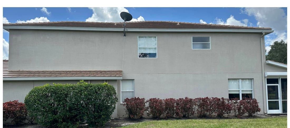 After: the same stucco wall soft washed clean of algae and staining in Southwest Florida — Gulf Coast Sealing & Pressure Cleaning