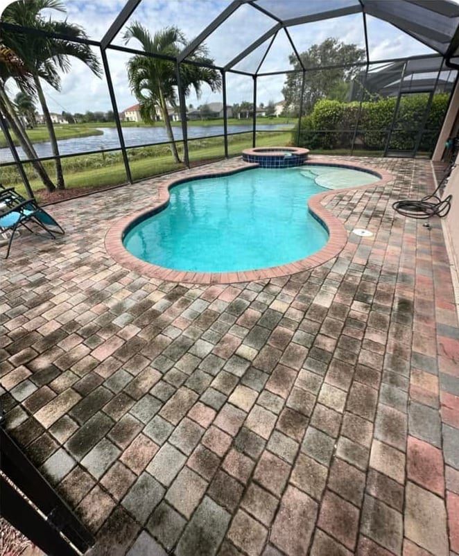 Before: a screened pool deck greened over with algae and mildew in Southwest Florida — Gulf Coast Sealing & Pressure Cleaning