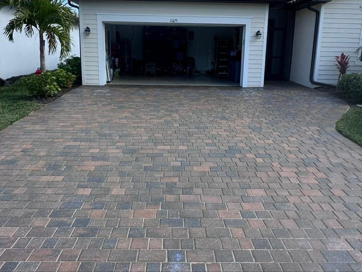 After: the same paver driveway cleaned, sanded and sealed in Bonita Springs, FL — Gulf Coast Sealing & Pressure Cleaning