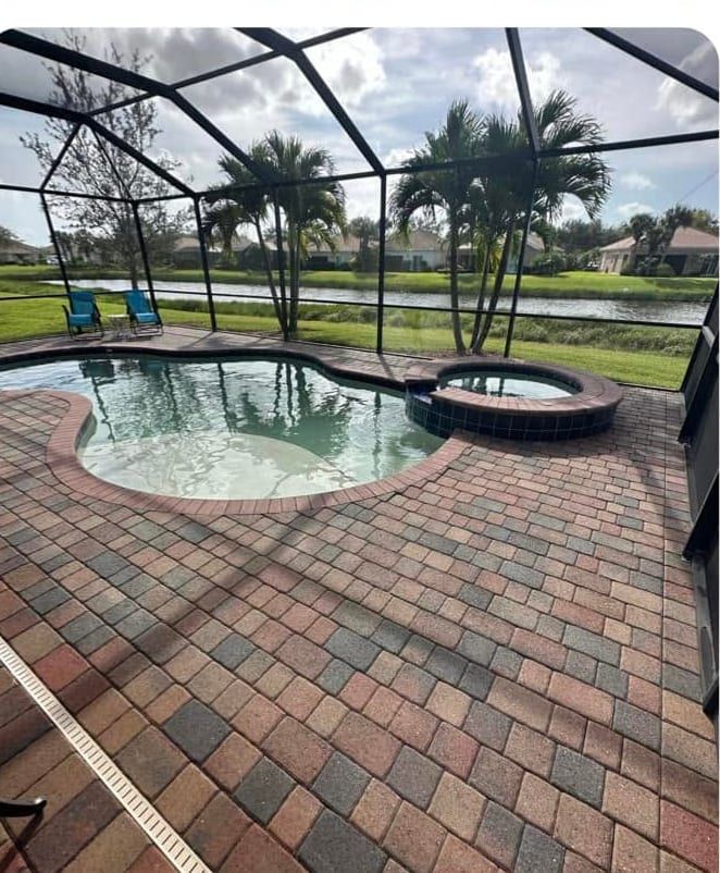 Screened pool deck pavers after pressure washing and re-sanding, no sealer applied, in Southwest Florida — Gulf Coast Sealing & Pressure Cleaning